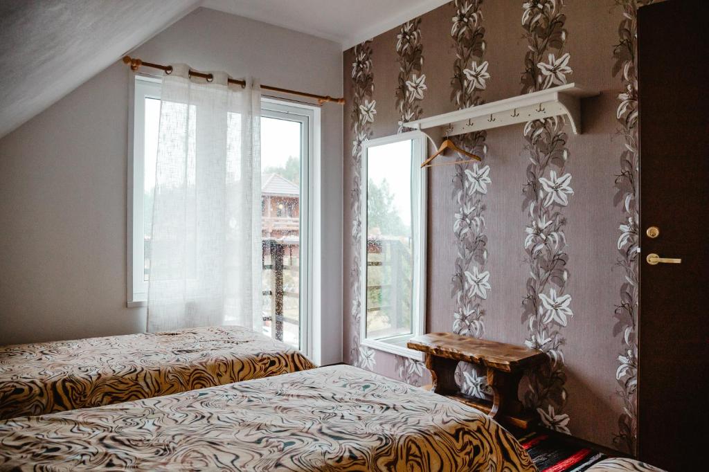 Postel nebo postele na pokoji v ubytování Tindioru Holiday House