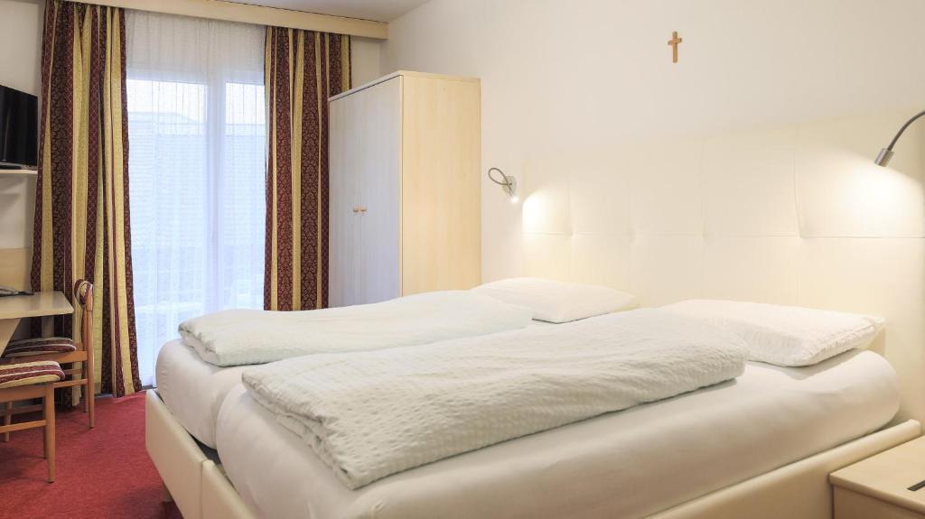 Postel nebo postele na pokoji v ubytování Hotel Markushof - Adults only
