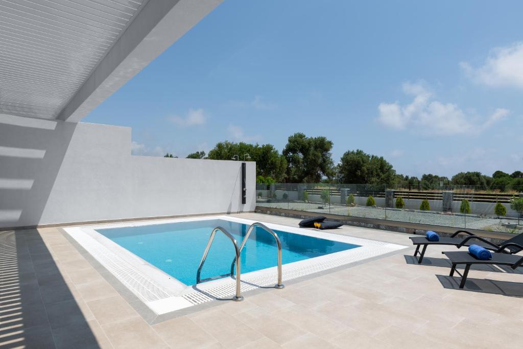The swimming pool at or close to Armonia Suites