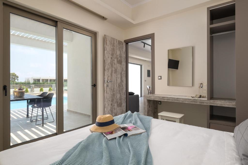 A bed or beds in a room at Armonia Suites