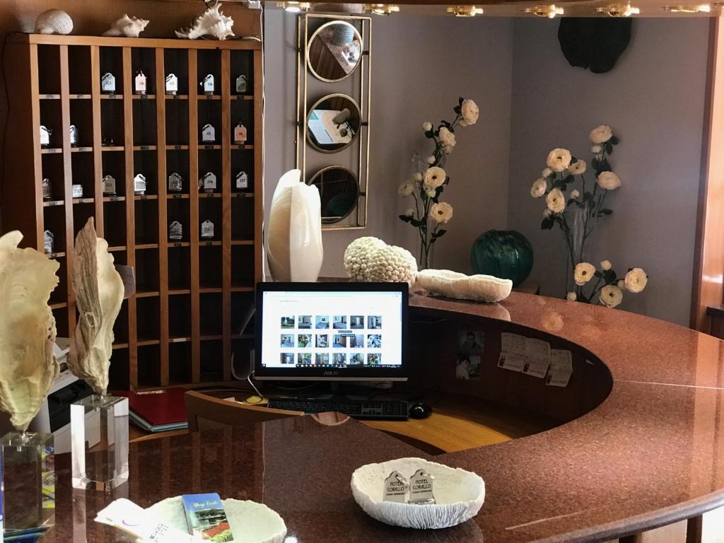 TV a/nebo společenská místnost v ubytování Hotel Corallo