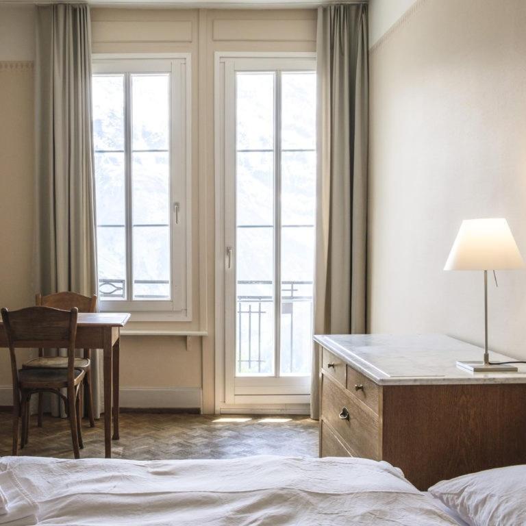 Postel nebo postele na pokoji v ubytování Hotel Regina