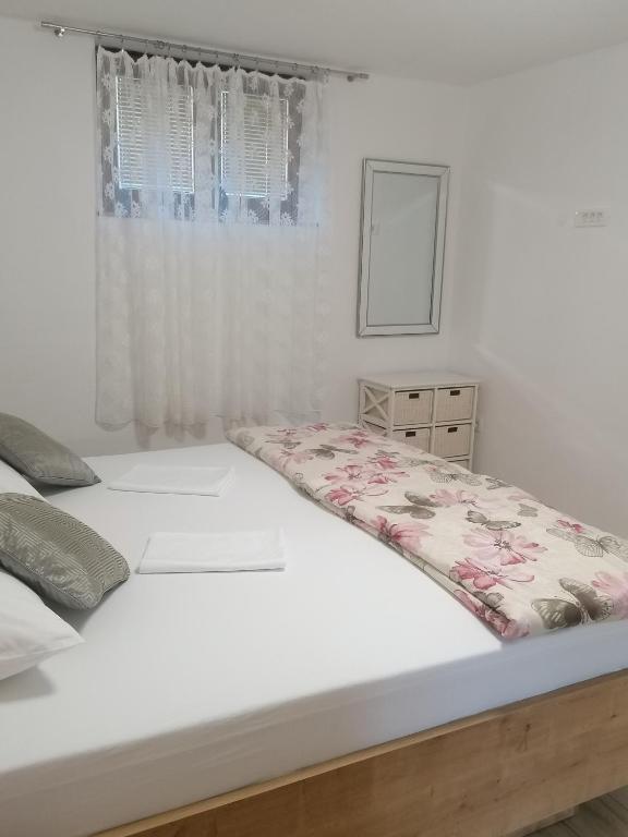 Postel nebo postele na pokoji v ubytování Apartment Maris