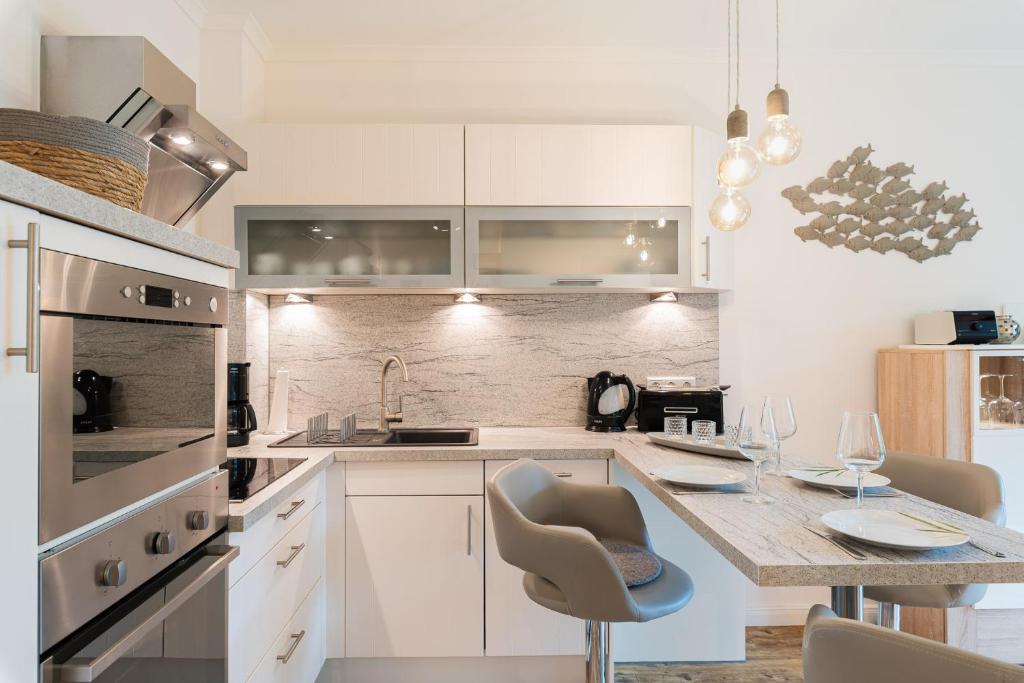 Kuchyň nebo kuchyňský kout v ubytování Residenz Seestern