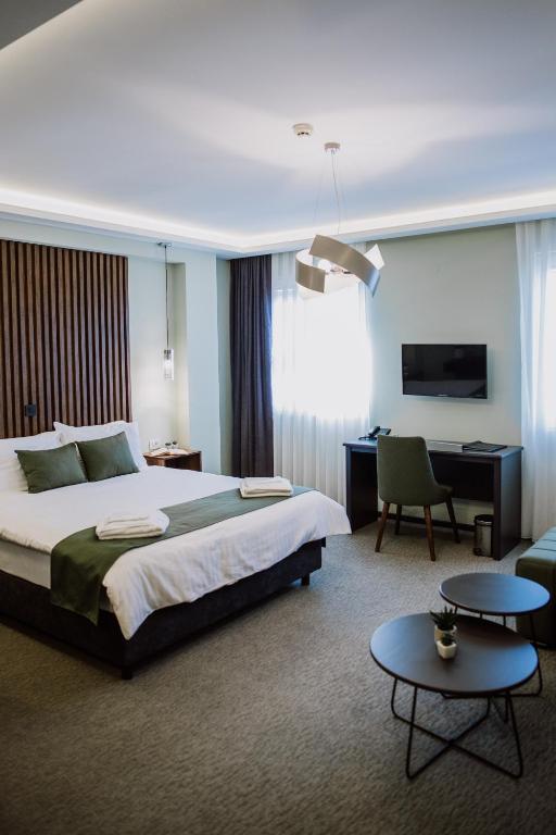 Postel nebo postele na pokoji v ubytování Hotel Kapri