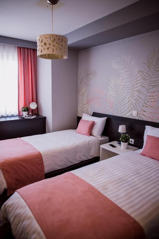 Postel nebo postele na pokoji v ubytování Hotel Kapri