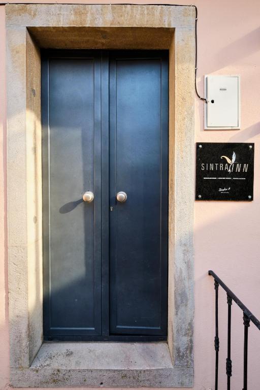 a blue door on the side of a building at Sintra Bliss A Part in Sintra