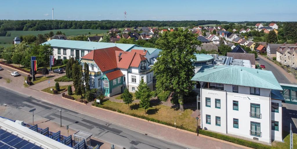 an aerial view of a city with buildings and a street at Recknitztal-Hotel Marlow in Marlow