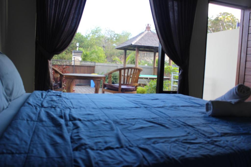 Кровать или кровати в номере Ady Homestay