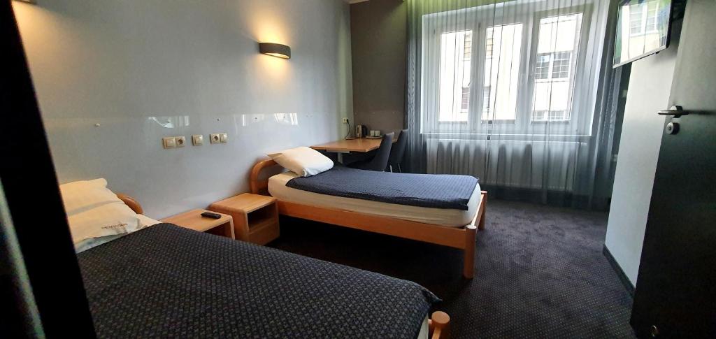 Postel nebo postele na pokoji v ubytování Pentagos