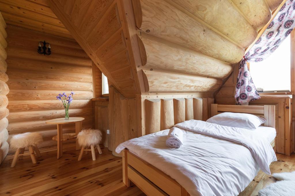 Posteľ alebo postele v izbe v ubytovaní Domki Tatra Lux Zakopane