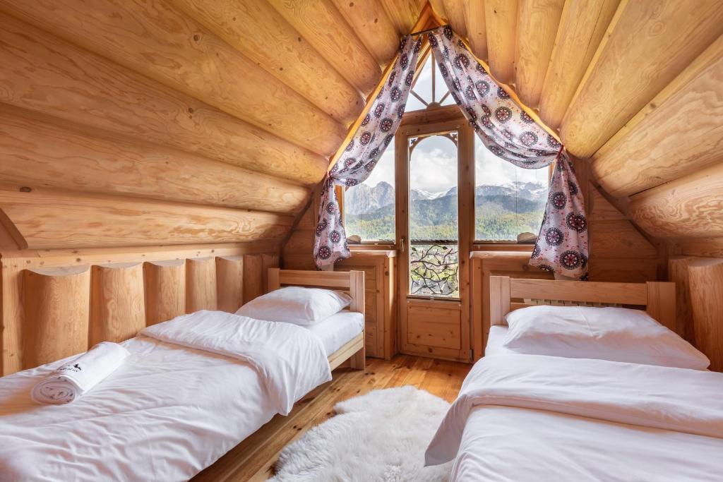 Posteľ alebo postele v izbe v ubytovaní Domki Tatra Lux Zakopane