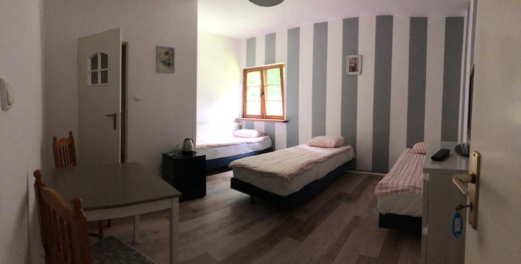 Letto o letti in una camera di Cezar Dom Wczasowy