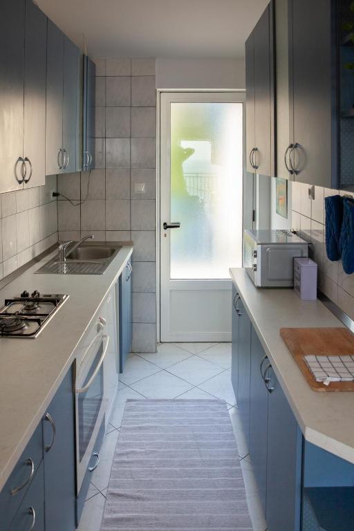 Kuchyň nebo kuchyňský kout v ubytování Apartment Iris
