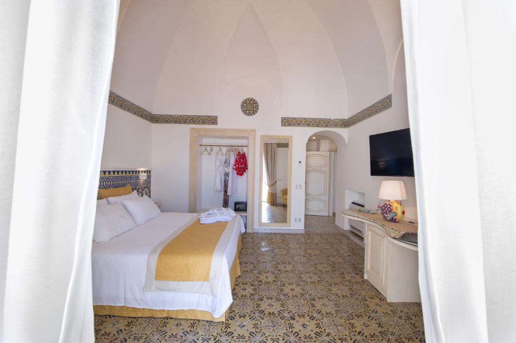 Postel nebo postele na pokoji v ubytování CASA CAPRILE POSITANO