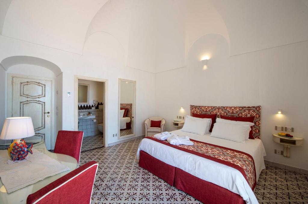 Postel nebo postele na pokoji v ubytování CASA CAPRILE POSITANO