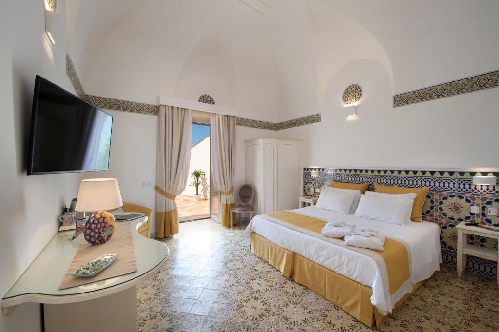 Postel nebo postele na pokoji v ubytování CASA CAPRILE POSITANO