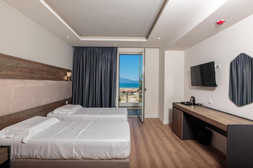 Postel nebo postele na pokoji v ubytování Real Hotel