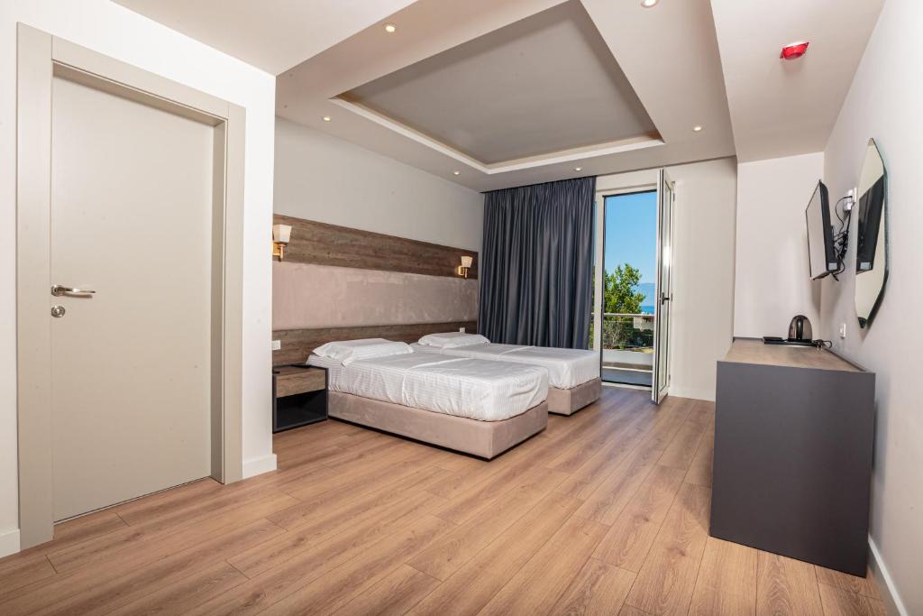 Postel nebo postele na pokoji v ubytování Real Hotel