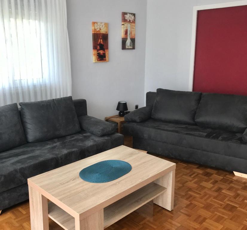 a living room with a couch and a coffee table at Ferienwohnung Noll in Alzenau in Unterfranken