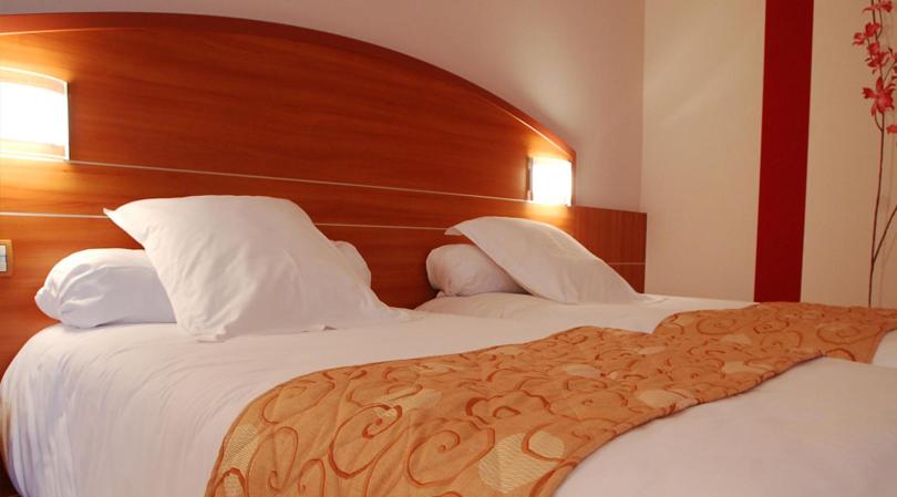 Postel nebo postele na pokoji v ubytování Hotel Cigoland