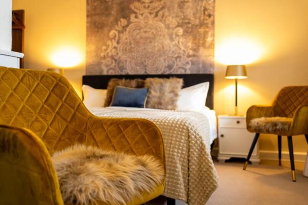 Postel nebo postele na pokoji v ubytování Hotel am Bach