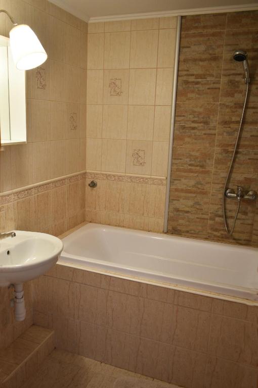 Kúpeľňa v ubytovaní Lagom Apartman