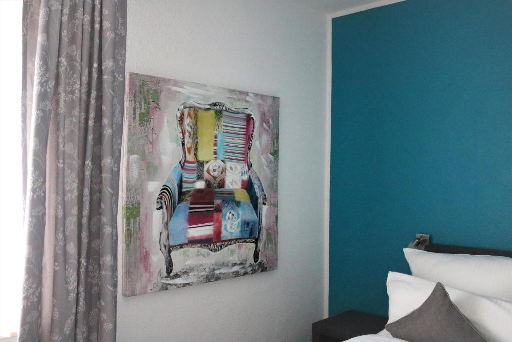 Postel nebo postele na pokoji v ubytování Hotel Schmerkötter