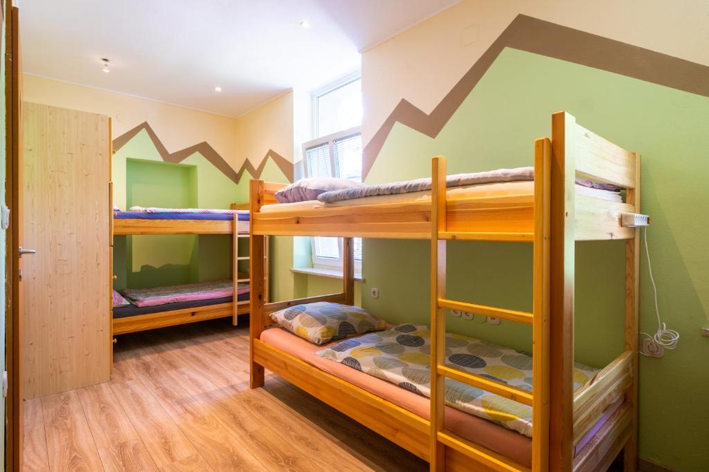 Postel nebo postele na pokoji v ubytování Bled Hostel