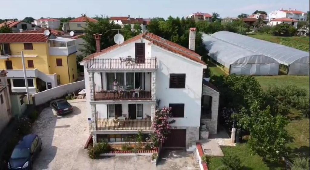 an aerial view of a white house with a balcony at APP-AMELIJAS in Zambratija