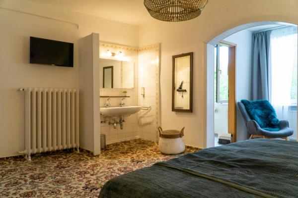 Postel nebo postele na pokoji v ubytování Hotel am Bach