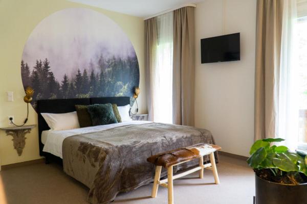 Postel nebo postele na pokoji v ubytování Hotel am Bach