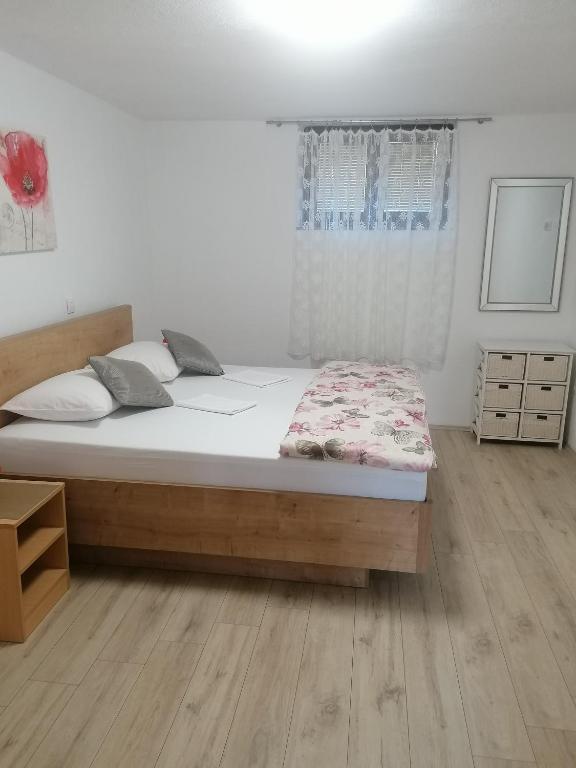 Postel nebo postele na pokoji v ubytování Apartment Maris