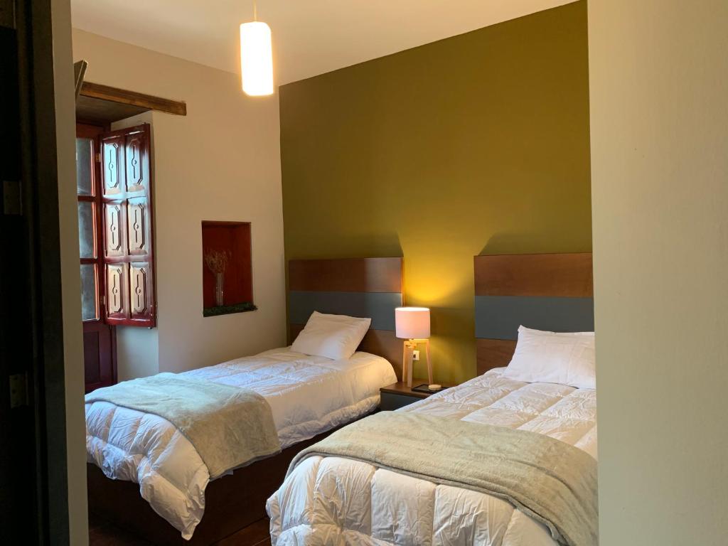 Postel nebo postele na pokoji v ubytování Casa Hidalgo