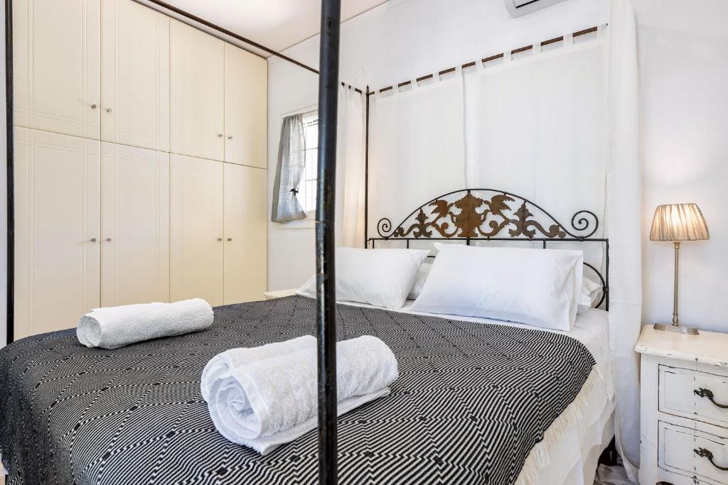A bed or beds in a room at Daphne's Lux Villa