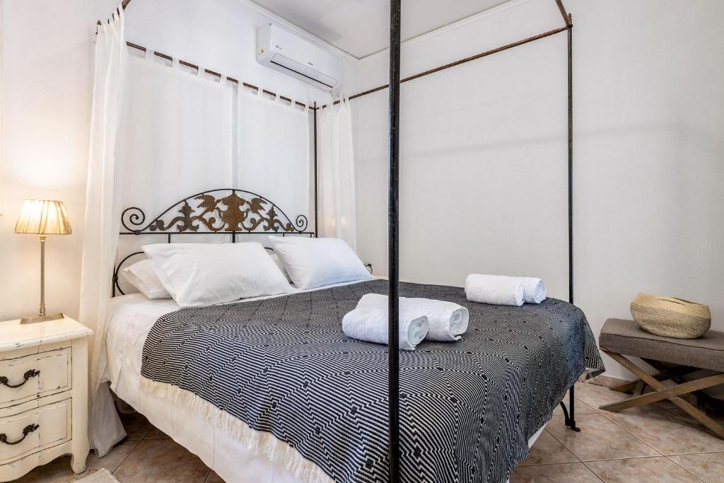 A bed or beds in a room at Daphne's Lux Villa