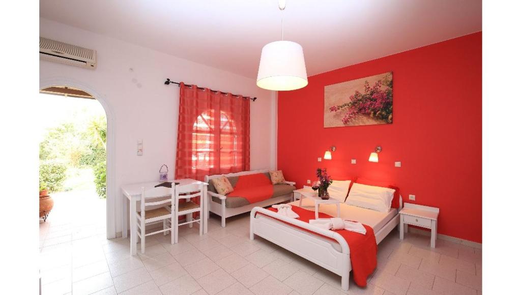 A bed or beds in a room at Athina Apartments