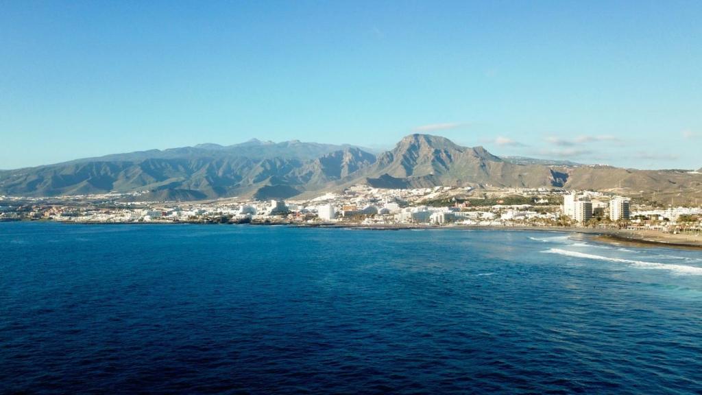 an aerial view of a beach with mountains and the ocean at New apartment near the beach in Playa Paraiso in Playa Paraiso