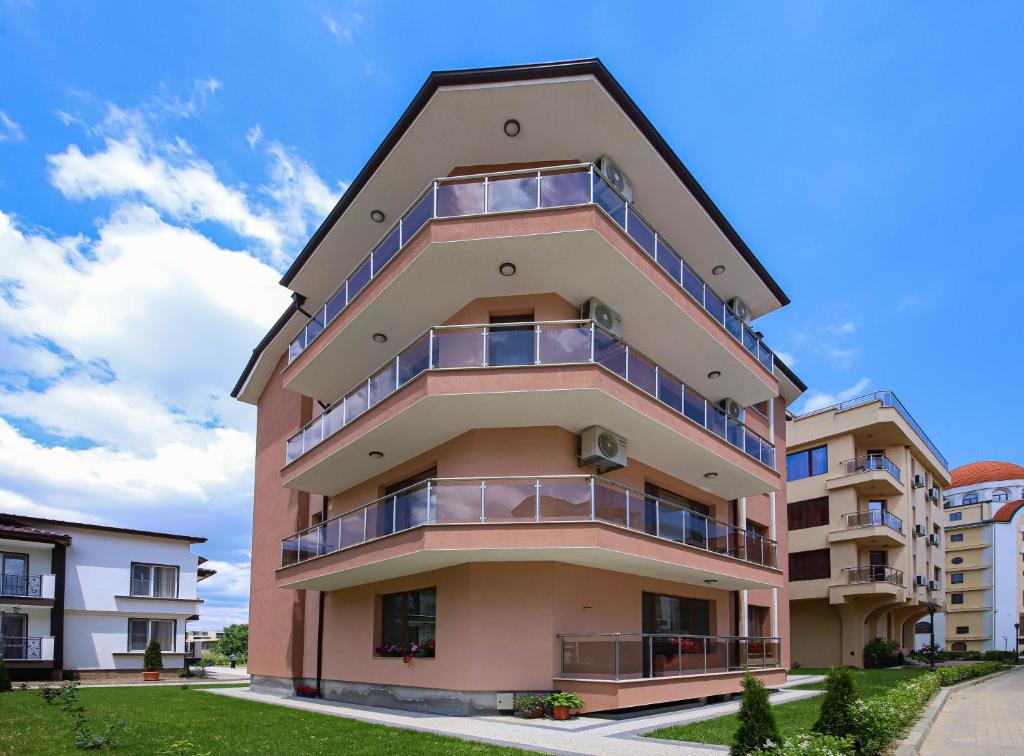 a building with balconies on the side of it at Guesthouse Phoenix in Obzor