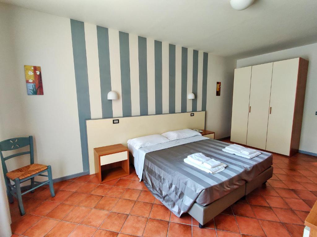 Postel nebo postele na pokoji v ubytování Toscana Verde