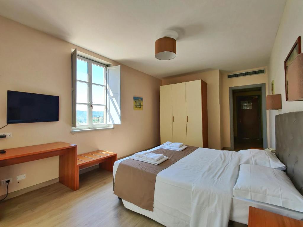 Postel nebo postele na pokoji v ubytování Toscana Verde