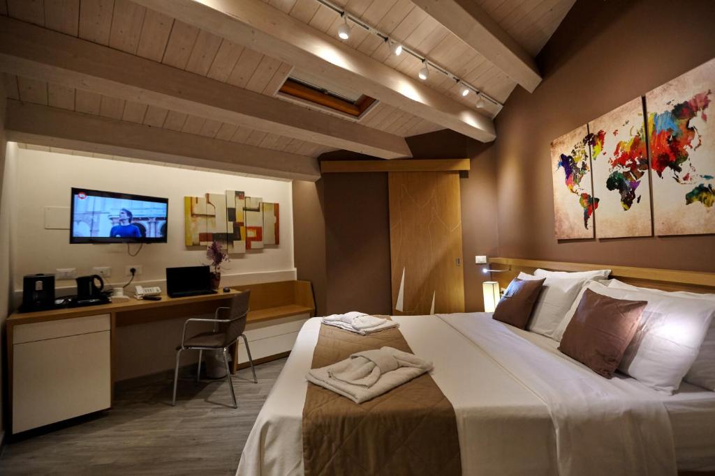 Postel nebo postele na pokoji v ubytování Hospitality Hotel