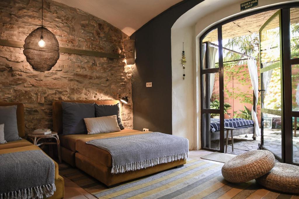 Postel nebo postele na pokoji v ubytování Hotel Aiguaclara