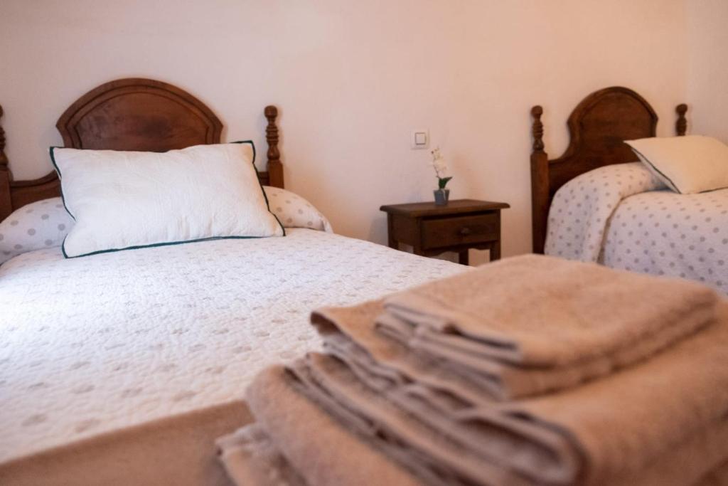 Postel nebo postele na pokoji v ubytování Casa Rural los Enebros