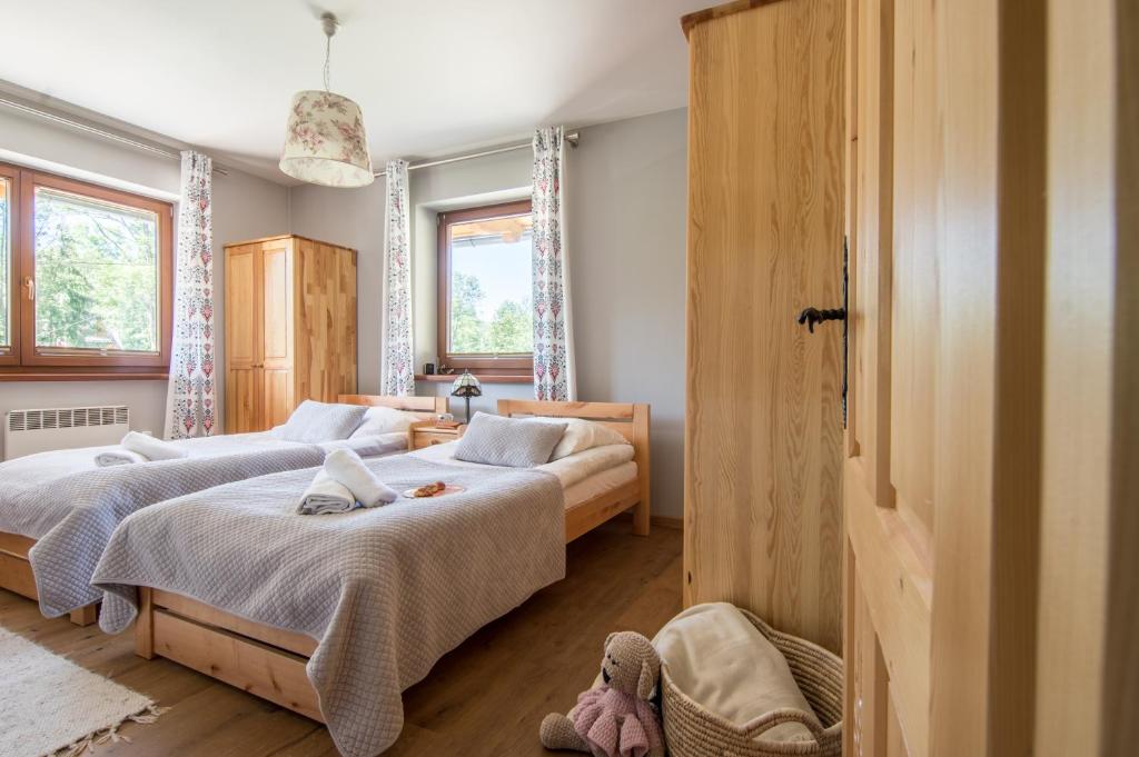 Posteľ alebo postele v izbe v ubytovaní Apartament Sobiczkowa Zakopane