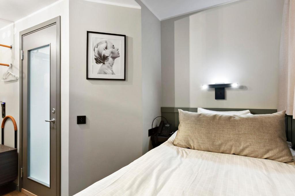 Postel nebo postele na pokoji v ubytování Best Western Hotel at 108