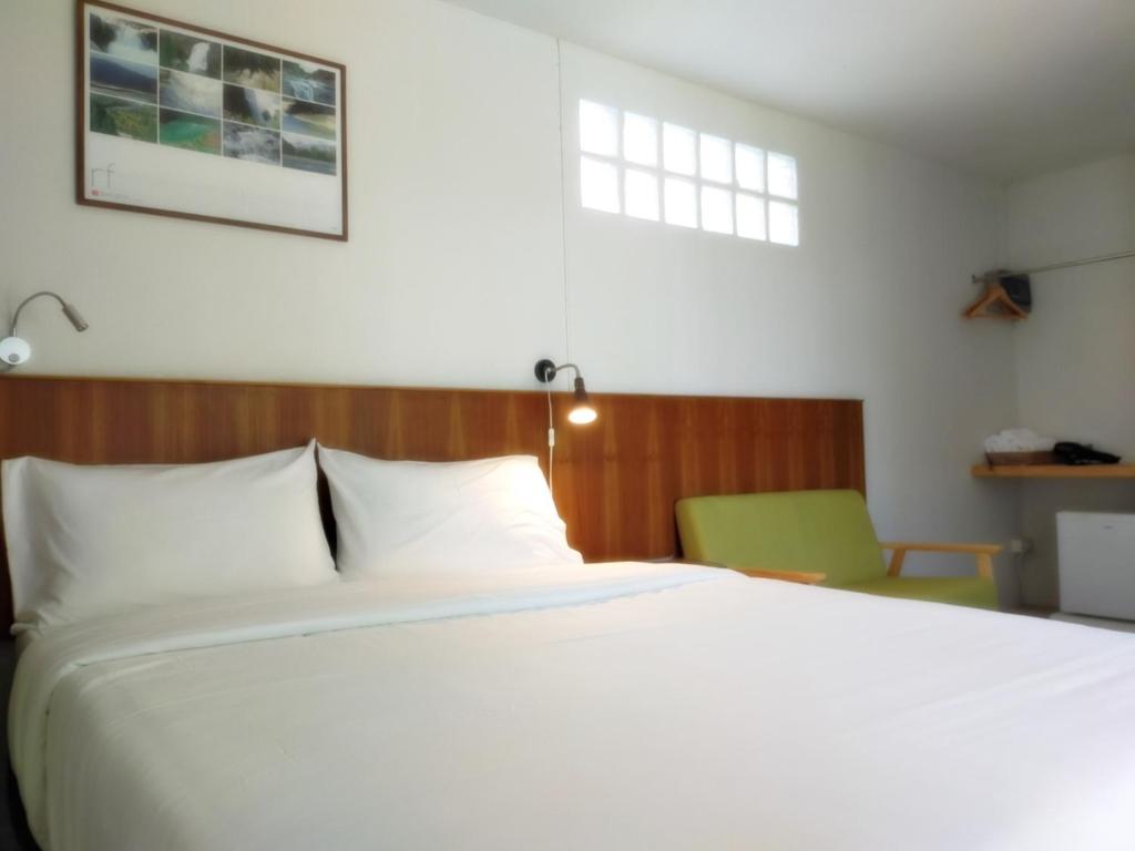 Postel nebo postele na pokoji v ubytování The Monkey Resort Donheang