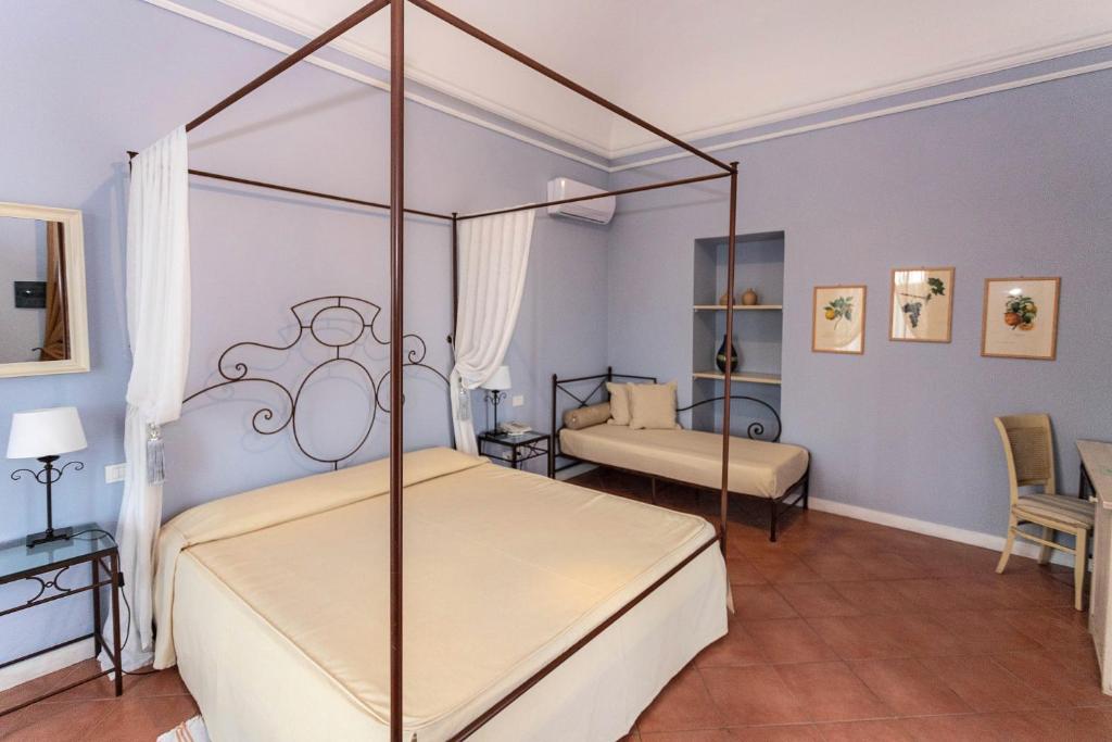 Postel nebo postele na pokoji v ubytování Etna Hotel