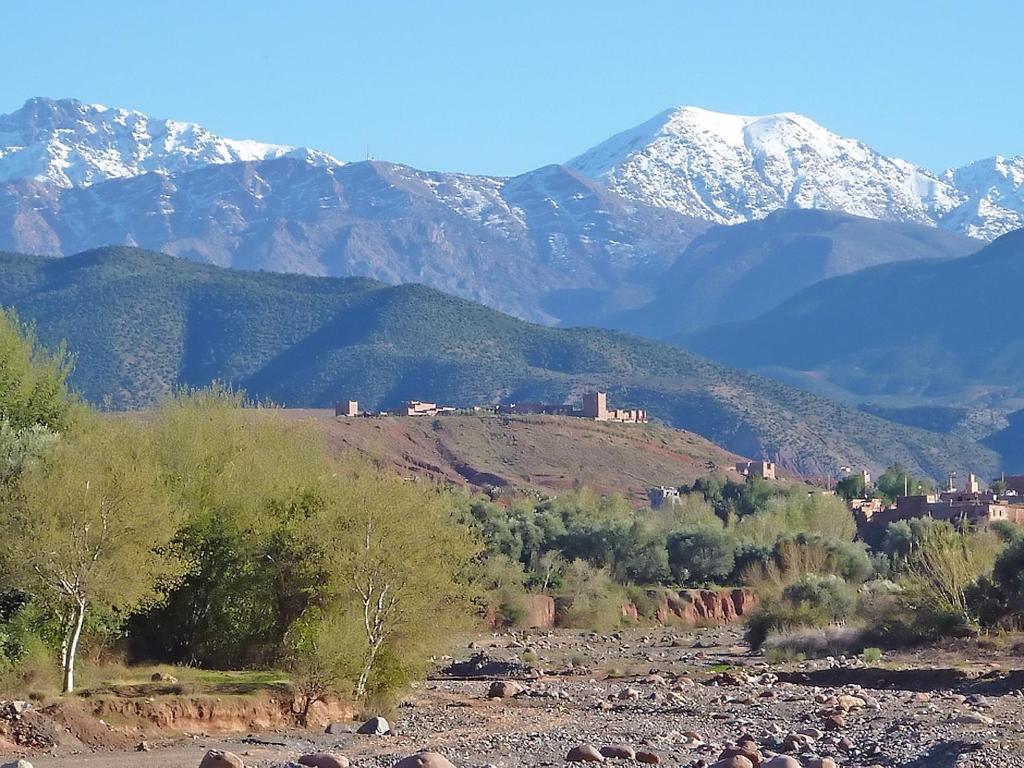 a view of a mountain range with snow covered mountains at Kasbah Angour in Tahannout