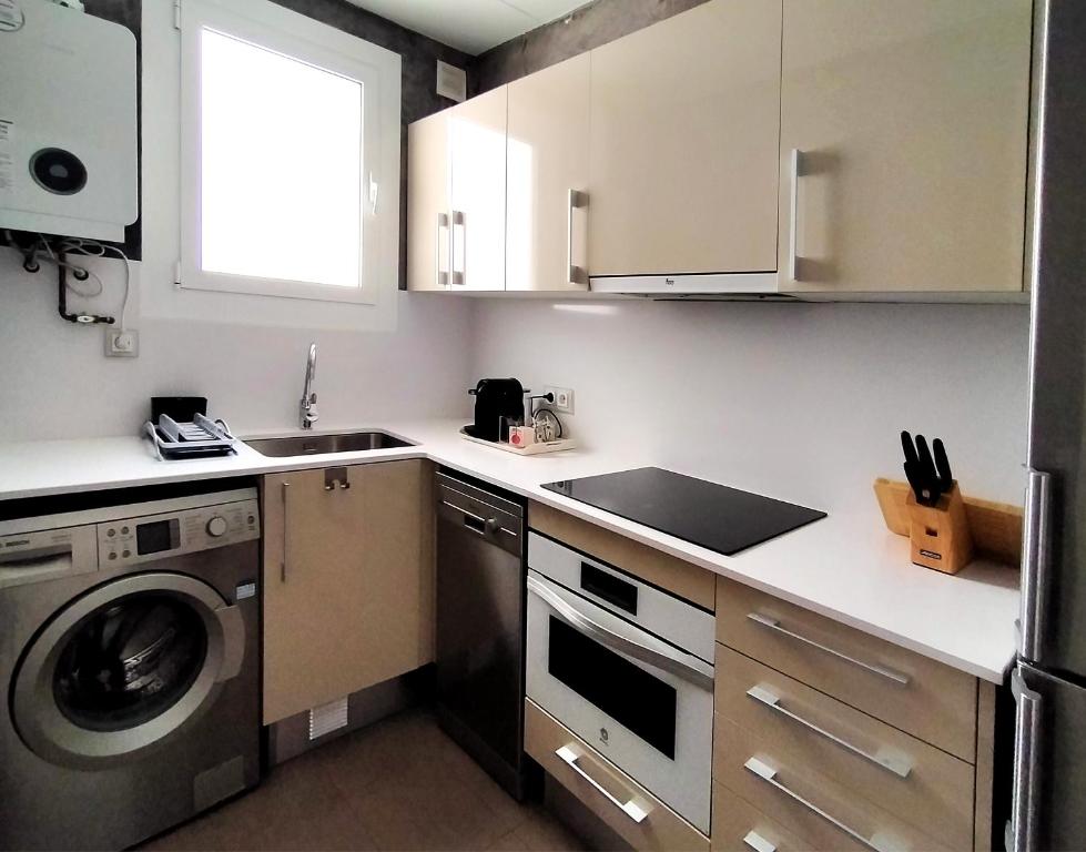 Kuchyňa alebo kuchynka v ubytovaní Quartprimera Apartments